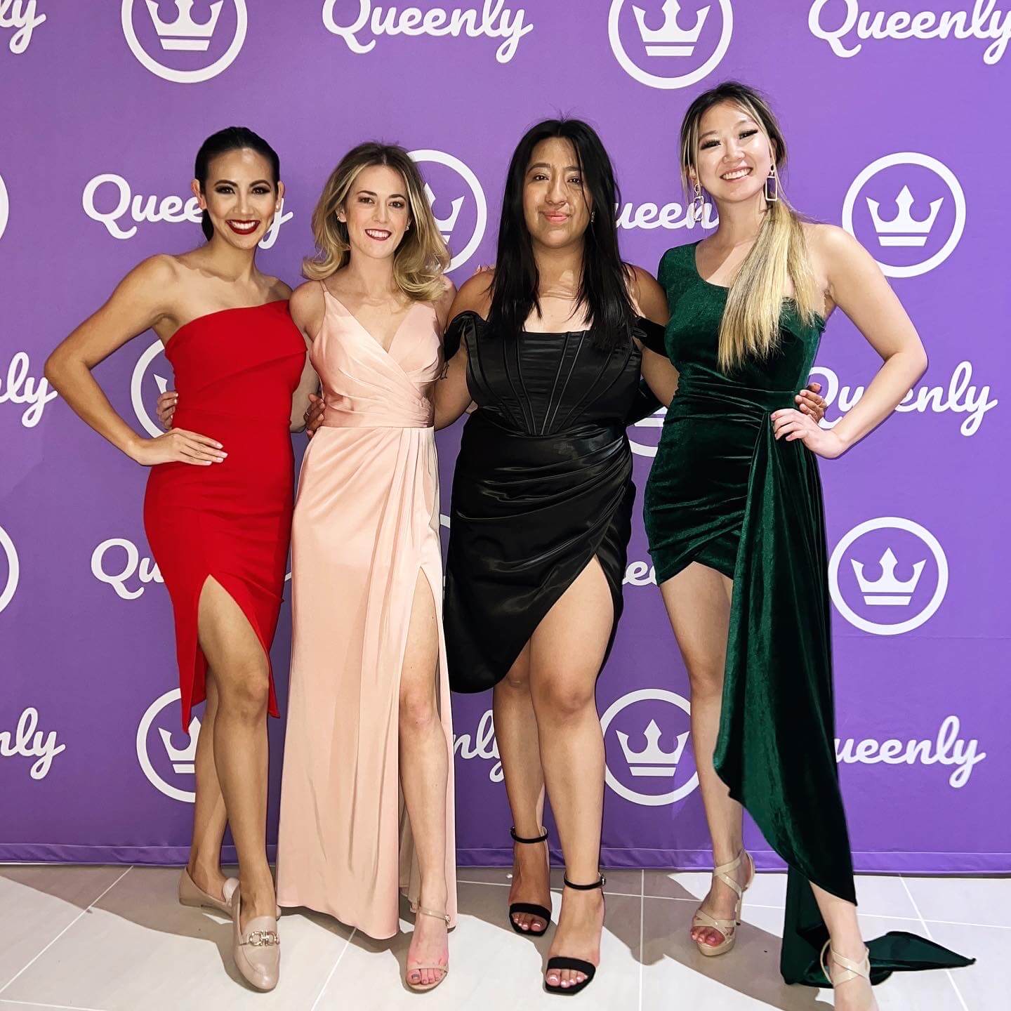 Queenly team in formal gowns at a pageant